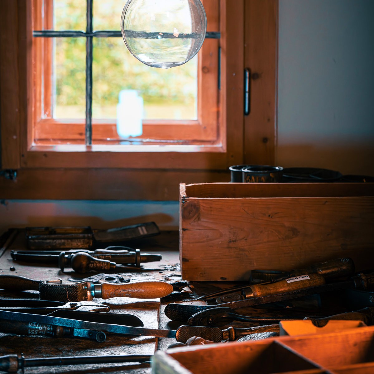 Authentic craftsmanship photography with historic tools, natural lighting, and rich workshop atmosphere.